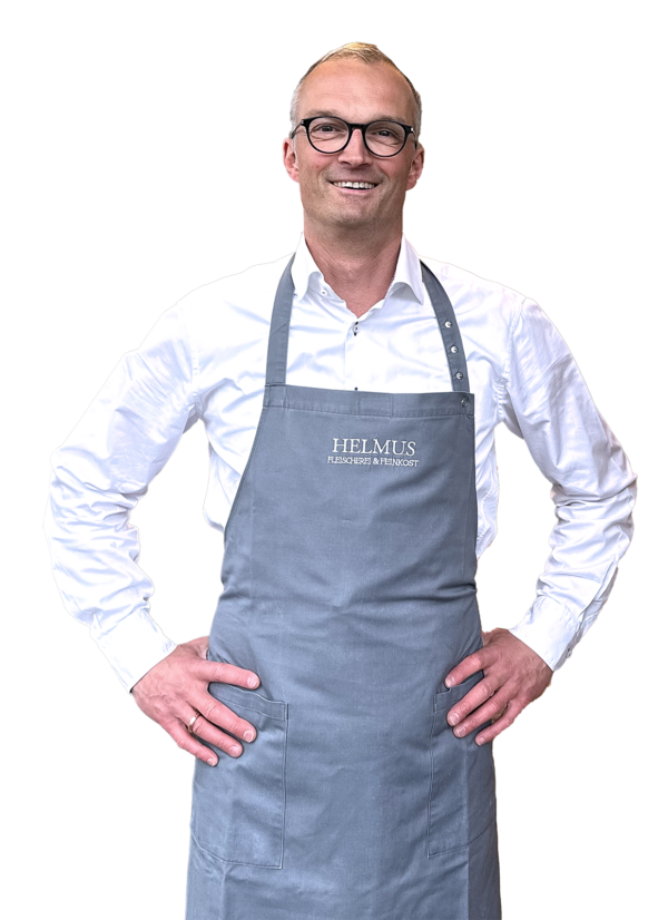 Stephan Helmus, der Inhaber, lächelt in die Kamera und strahlt Freundlichkeit aus.